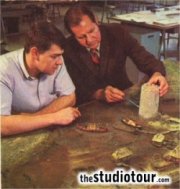 Scenic designers work on a scale model of the tower prior to construction. (From 'Inside Universal Studios', 1968)