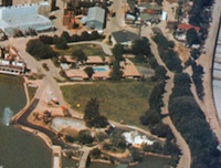 1 - Aerial view (from Inside Universal Studios, 1973) showing Park Lake and the Riverboat on the left, the blue Motel swimming pool can be seen centre with the LA River flood channel on the right - click to enlarge Apartments - 1 - Aerial view (from Inside Universal Studios, 1973) showing Park Lake and the Riverboat on the left, the blue Motel swimming pool can be seen centre with the LA River flood channel on the right
