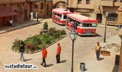 A GlamorTram weaves its way through The Court of Miracles in this posed publicity shot. The tram never actually enters the Court of Miracles. (From 'Inside Universal Studios', 1968)
