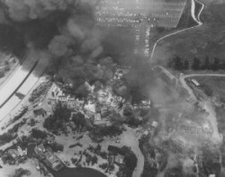 Aerial view of flames raging out of control on Universal Studios' backlot on May 15, 1967, sending towering columns of smoke into the sky. Photo taken from KTLA-TV 5 helicopter piloted by Larry Scheer. Photograph by Harold Morby. Photo from the LA Public Library Photo Catalog 