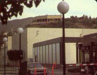 Front gate with the Hitchcock Theatre in the background and the Universal City sign at the rear of the Castle Theatre on the hill