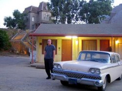 Photo - John Murdy outside the restored Bates Motel