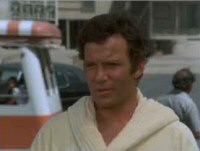 Still of William Shatner with a GlamorTram in the background