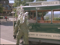 Hannibal dressed as a sea monster approaches the trolley car in what is now the Entrance Plaza. Womphoppers restaurant can be seen in the distance.