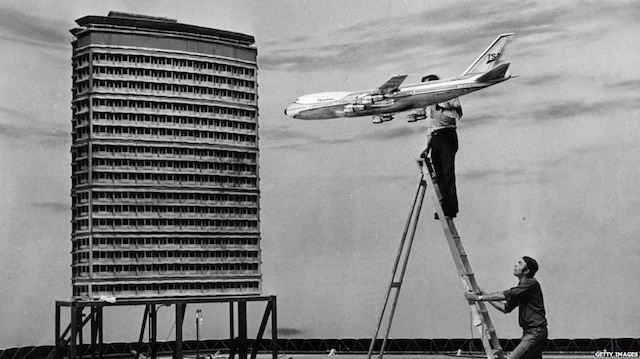 Scale models of Boeing 747 and skyscraper prepare to collide on stage at Pinewood Studios