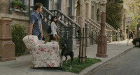 Bruce Almighty - 3 - Jim Carrey on Brownstone Street with a sofa (still from DVD release)