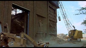 Holiday on the Buses - still - 1 - Still from the final moments of the movie showing Stage 06 at MGM Borehamwood being demolished.