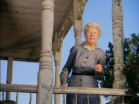Lillian Bronson as Winifred, on the porch of the Psycho House